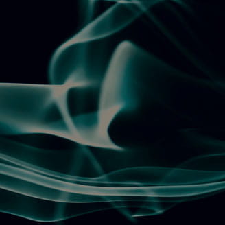 Green swirl on black background